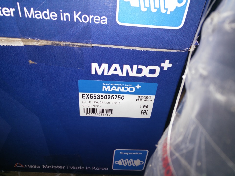 Амортизатор левый Mando газмяс: EX5535025750 — Hyundai Accent (2G). Запчасти на фото: EX5535025750