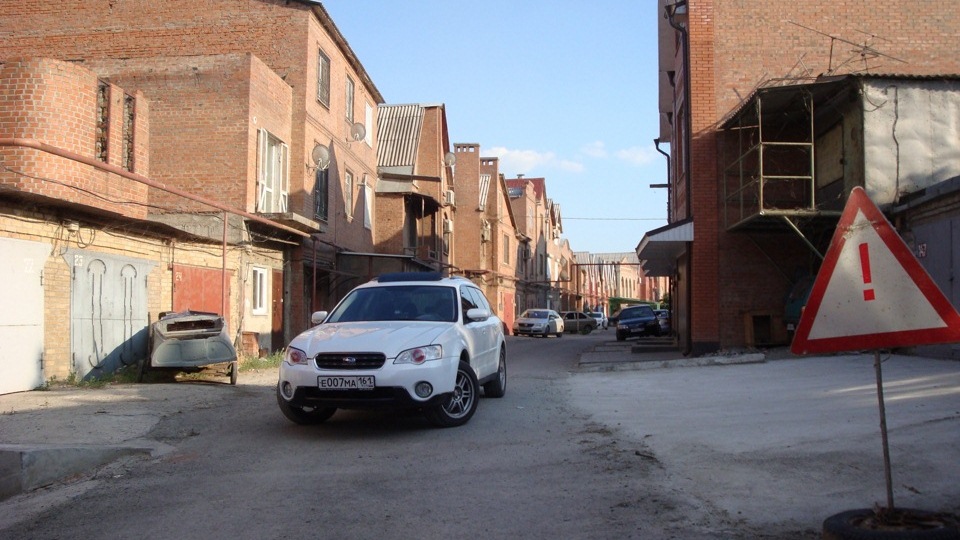 Subaru Outback white wagon