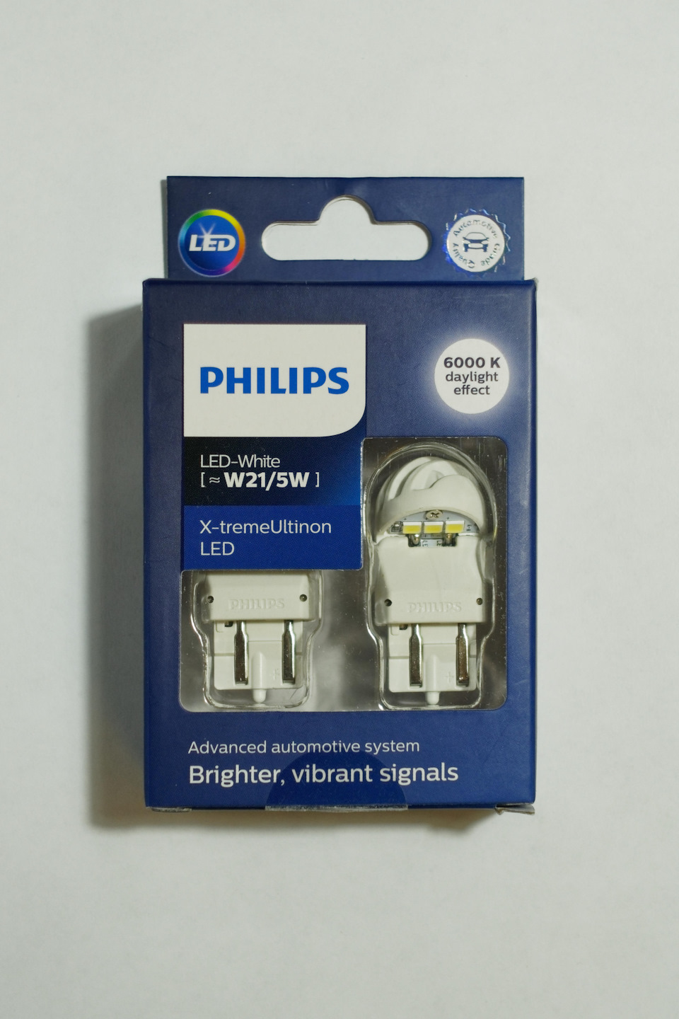 Заказал себе в сетевом маге www.onlinetrade.ru/ за 1750 рублей брендовые лампочки Philips W21/5W X-tremeUltinon LED gen2 — 11066XUWX2. Заявлена яркость 240 люмен в ДХО и 40 в режиме габаритов. — Opel Meriva (B). Запчасти на фото: 11066XUWX2